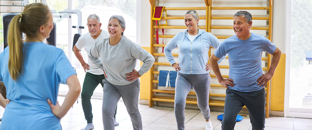 A group of elderly people at a fitness class